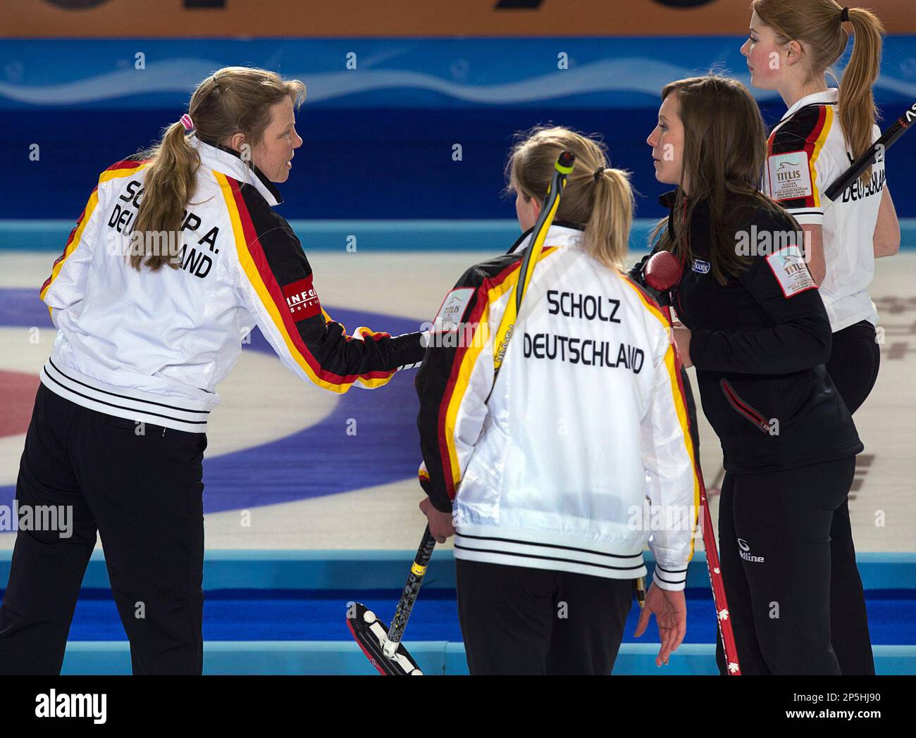 Canada's Rachel Homan, right, shakes hands with Germany skip Andrea ...