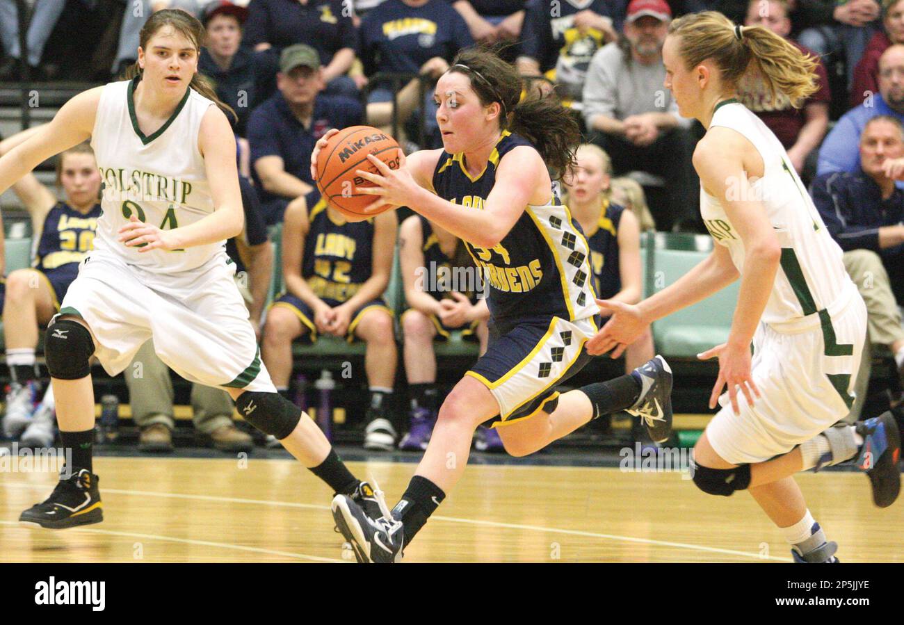 Pressured by Colstrip's Brina Hull (24) and Jere Dennehy (20), Deer