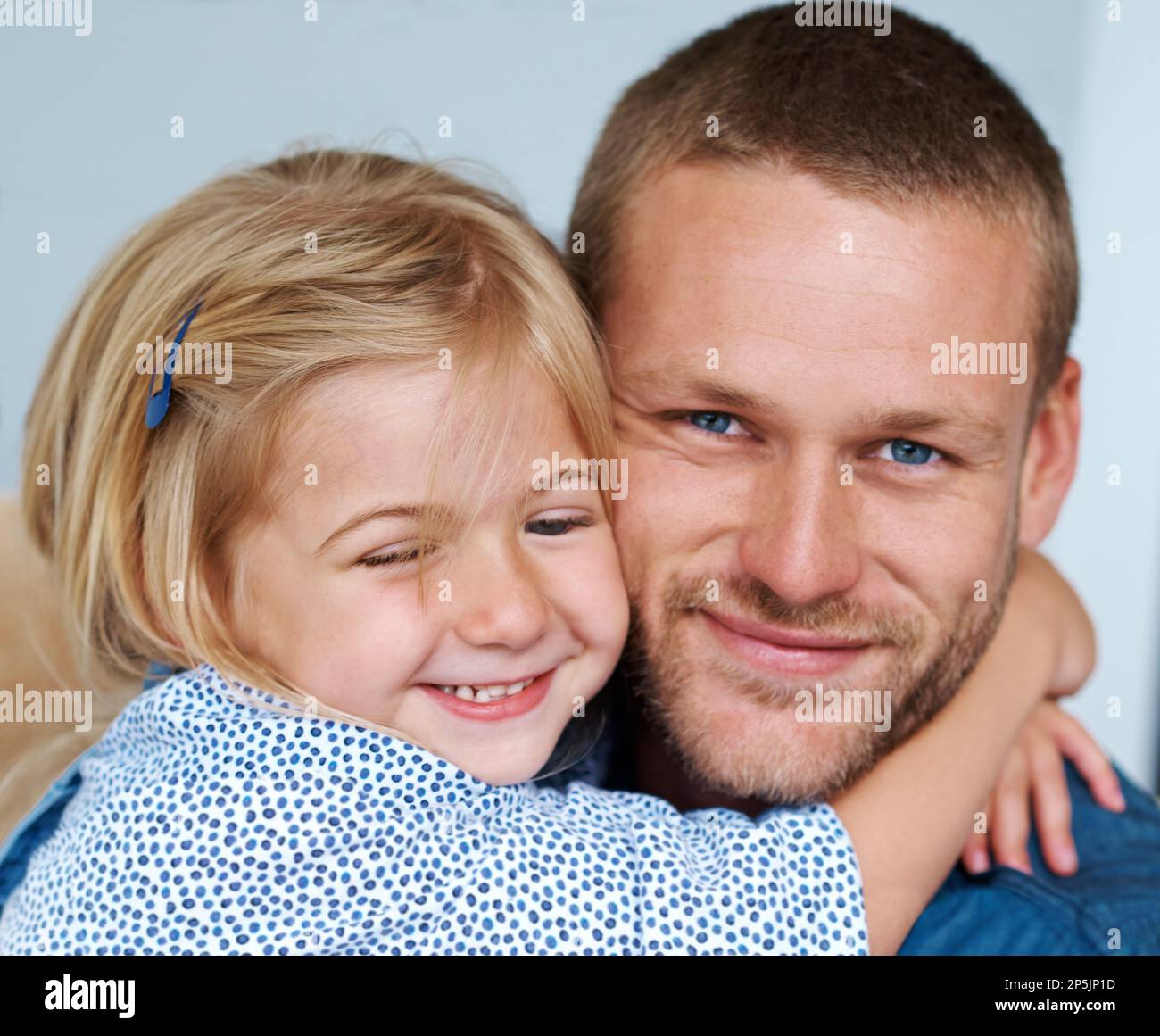 hes-putty-in-her-hands-portrait-of-an-adorable-little-girl-hugging-her