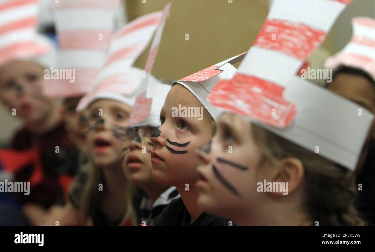 Kindergardener Caden Skiles listens as Michelle Jordan reads 'Green