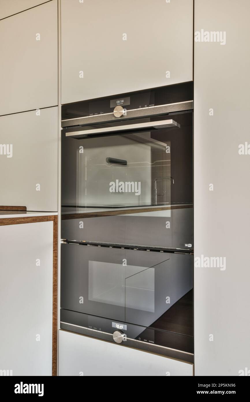 the inside of an oven in a kitchen with white and wood trims