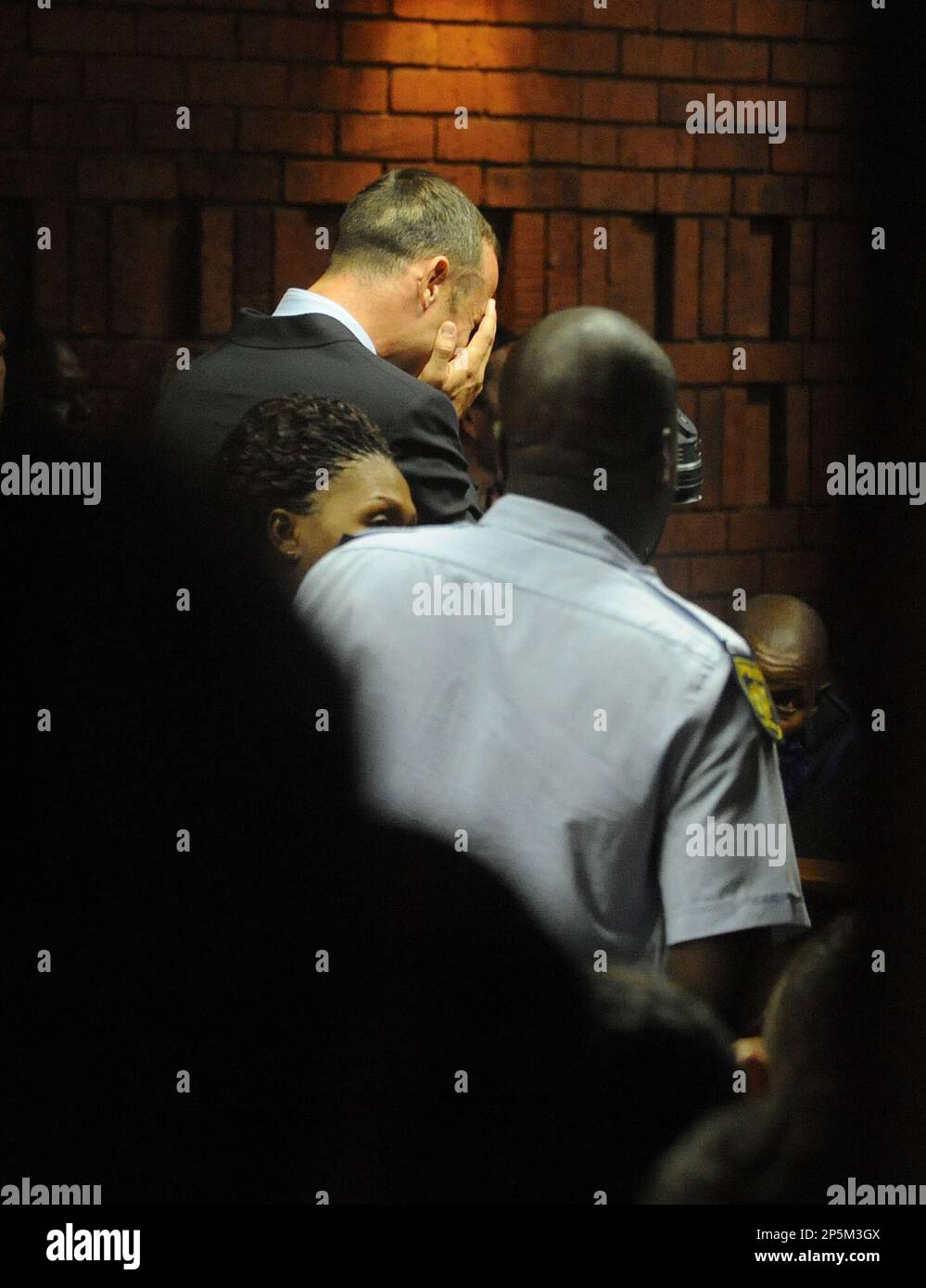 South African athlete Oscar Pistorius reacts, in court in Pretoria