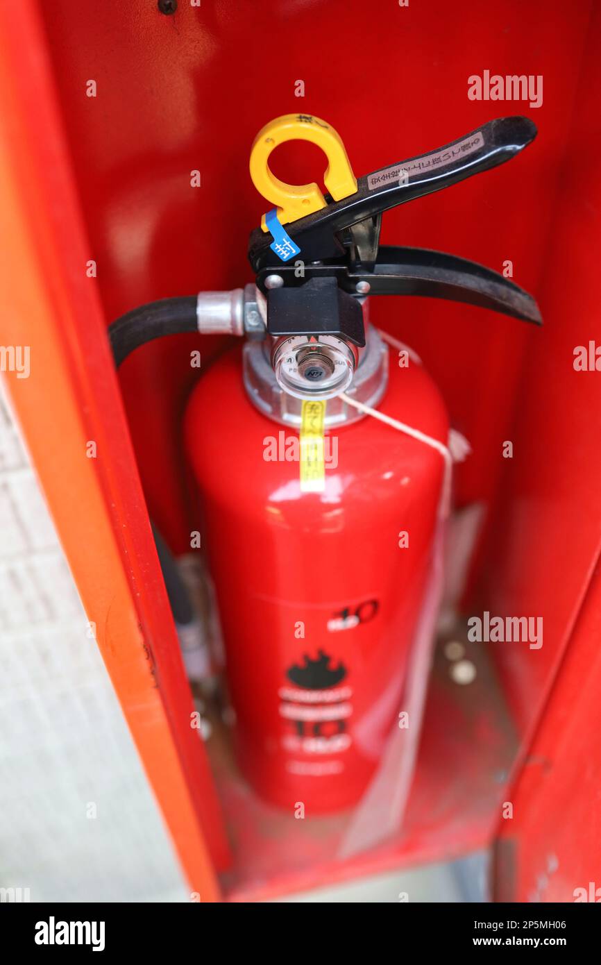Tokyo, Japan, March 2023.Japanese fire extinguisher box and fire