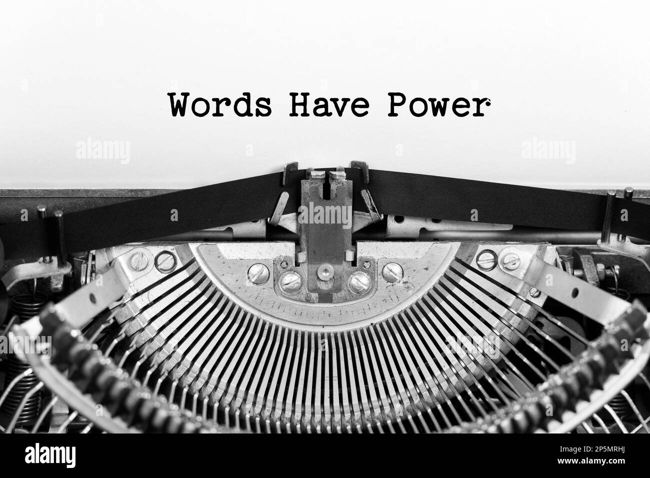 Words Have Power phrase closeup being typing and centered on a sheet of paper on old vintage typewriter mechanical Stock Photo