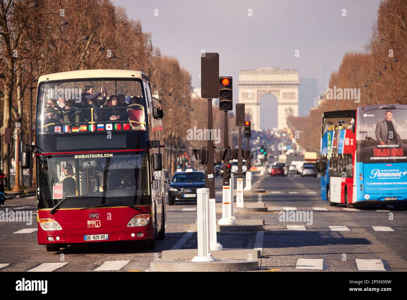 Arc de Triomphe Paris, and a big bus tour open top bus Stock Photo