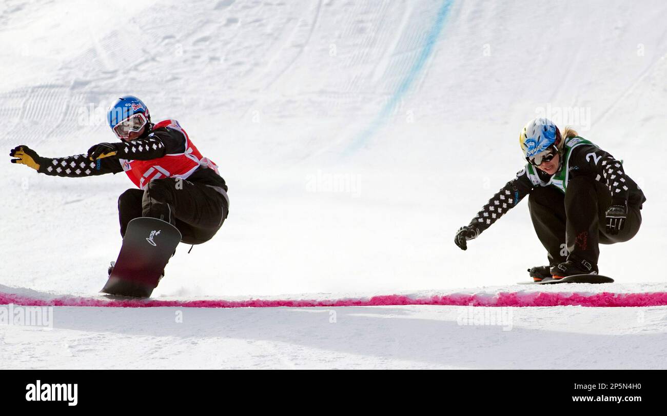 Maelle Ricker, left, from Canada, across the finished line ahead of ...