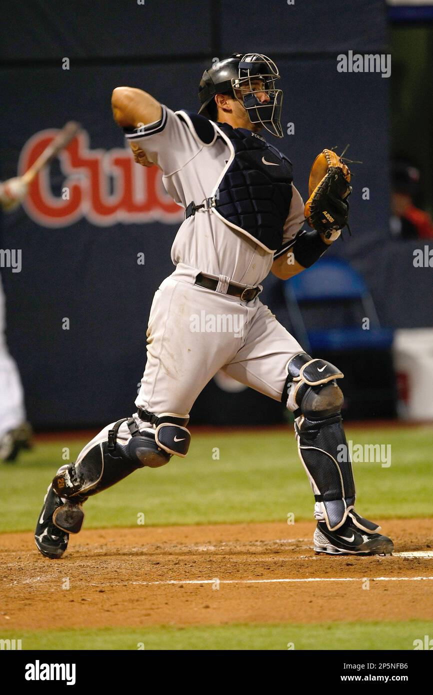 MINNEAPOLIS, MN - JULY 9: Catcher Jorge Posada #20 of the New York Yankees  throws the baseball down to second base against the Minnesota Twins at  Hubert H. Humphrey Metrodome on July