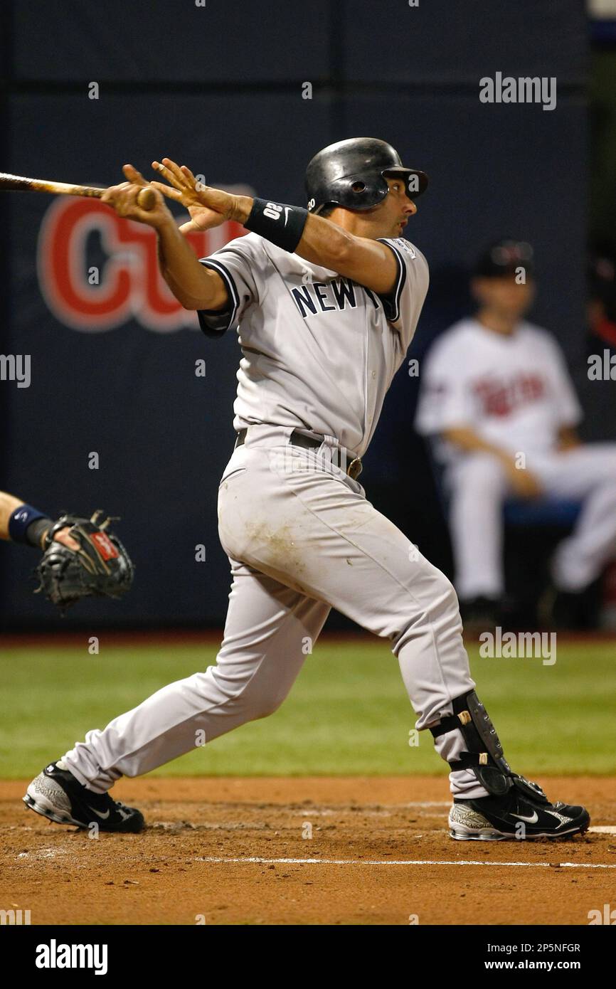 New York Yankees' Jorge Posada (20) hits a two run home run to