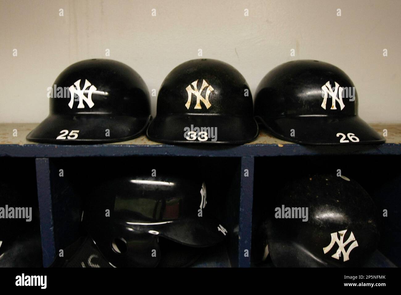 MINNEAPOLIS, MN - JULY 8: A detail view of the New York Yankees batting  helmets in the dugout during the game between the New York Yankees against  the Minnesota Twins at Hubert