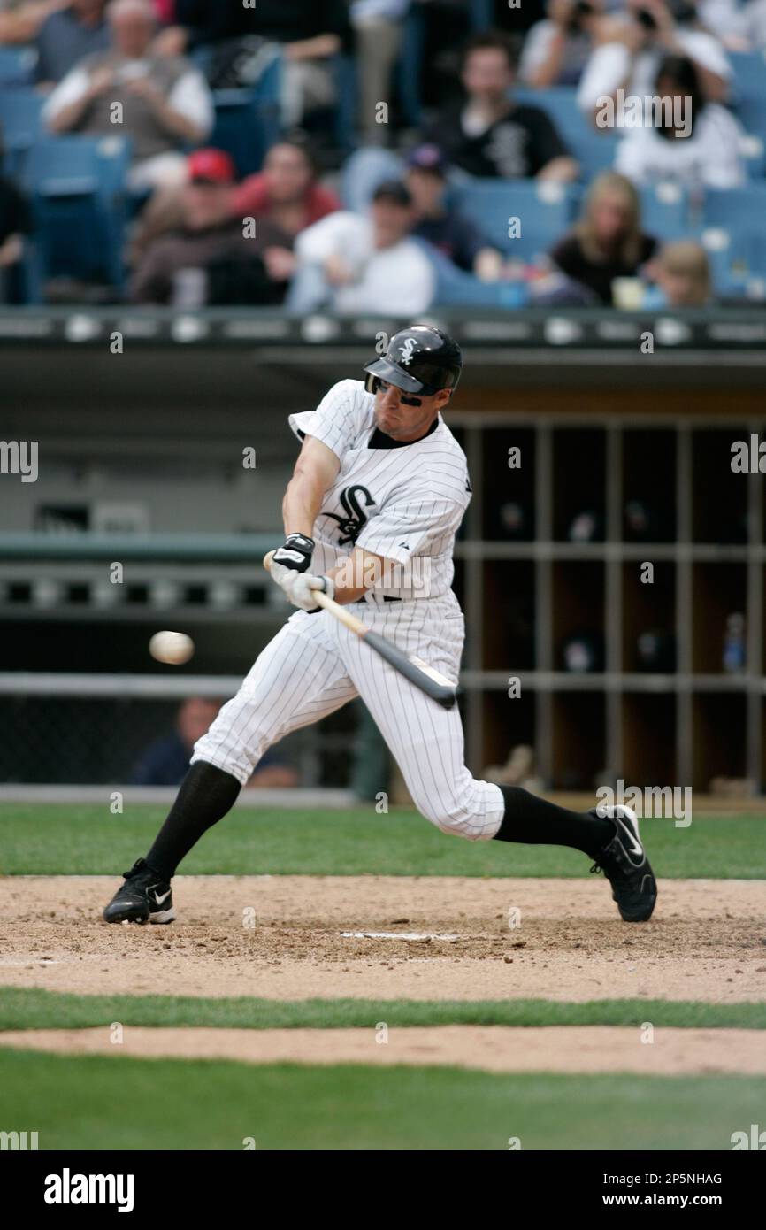 CHICAGO - APRIL 6: Scott Podsednik #22 of the Chicago White Sox swings to  hit the pitch against the Cleveland Indians at U.S. Cellular Field on April  6, 2005 in Chicago, Illinois.