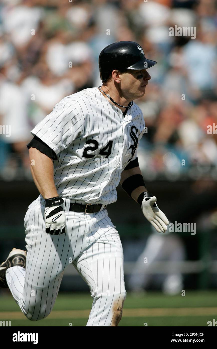 CHICAGO - APRIL 16: Third baseman Joe Crede #24 of the Chicago White Sox  runs to first base during the game against the Seattle Mariners at U.S.  Cellular Field on April 16