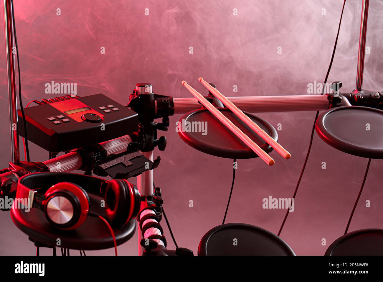 Modern electronic drum kit and smoke on grey background, toned in pink ...