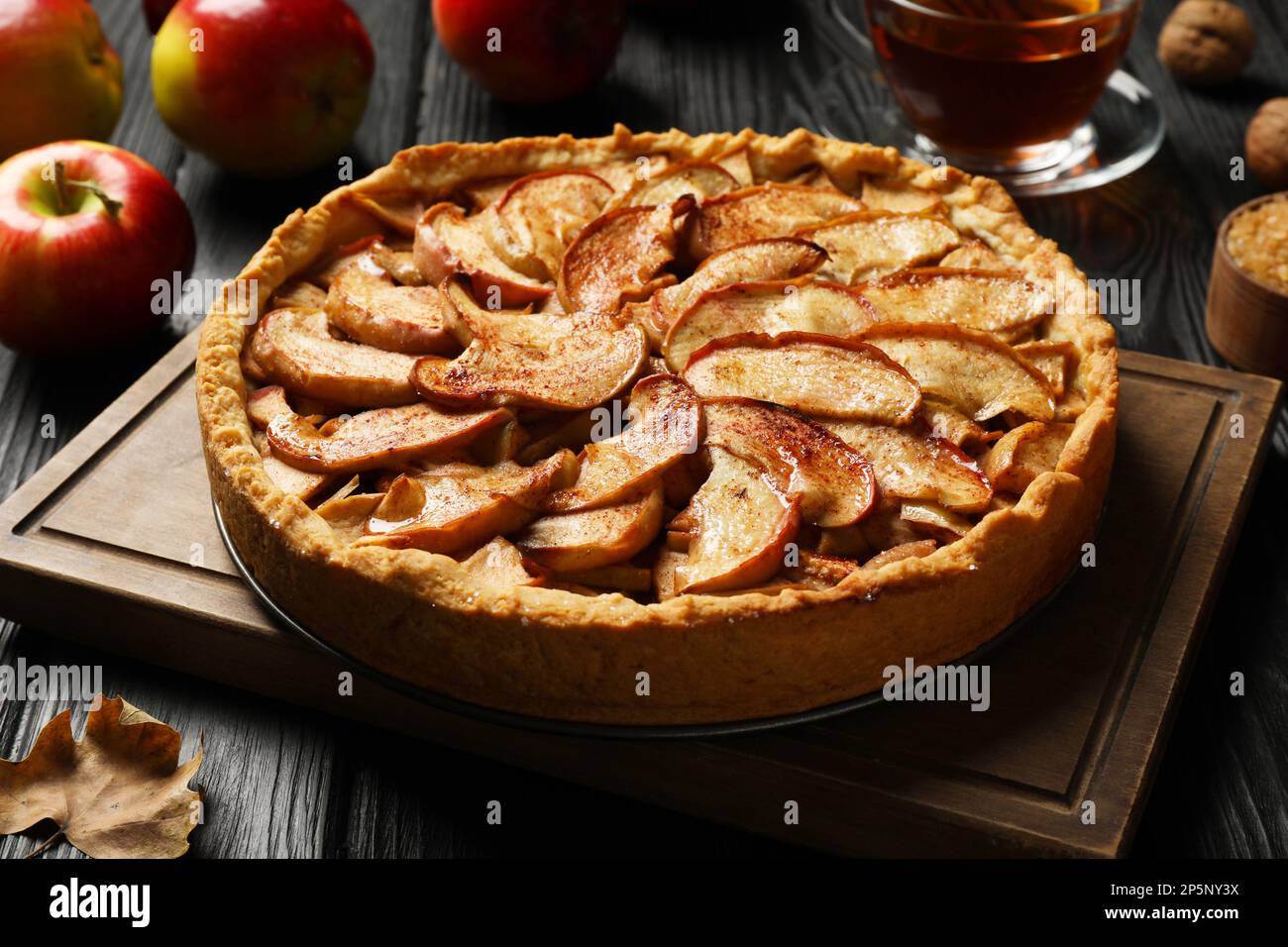 Delicious apple pie on black wooden table Stock Photo