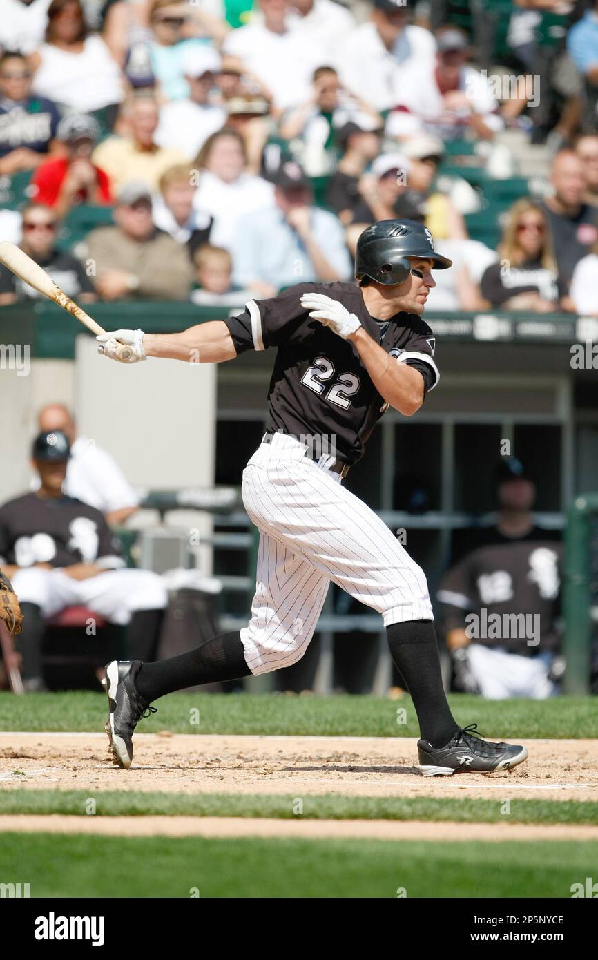 CHICAGO, IL - SEPTEMBER 7: Outfielder Scott Podsednik #22 of the Chicago White  Sox follows through on his swing after hitting the baseball against the  Boston Red Sox at U.S. Cellular Field