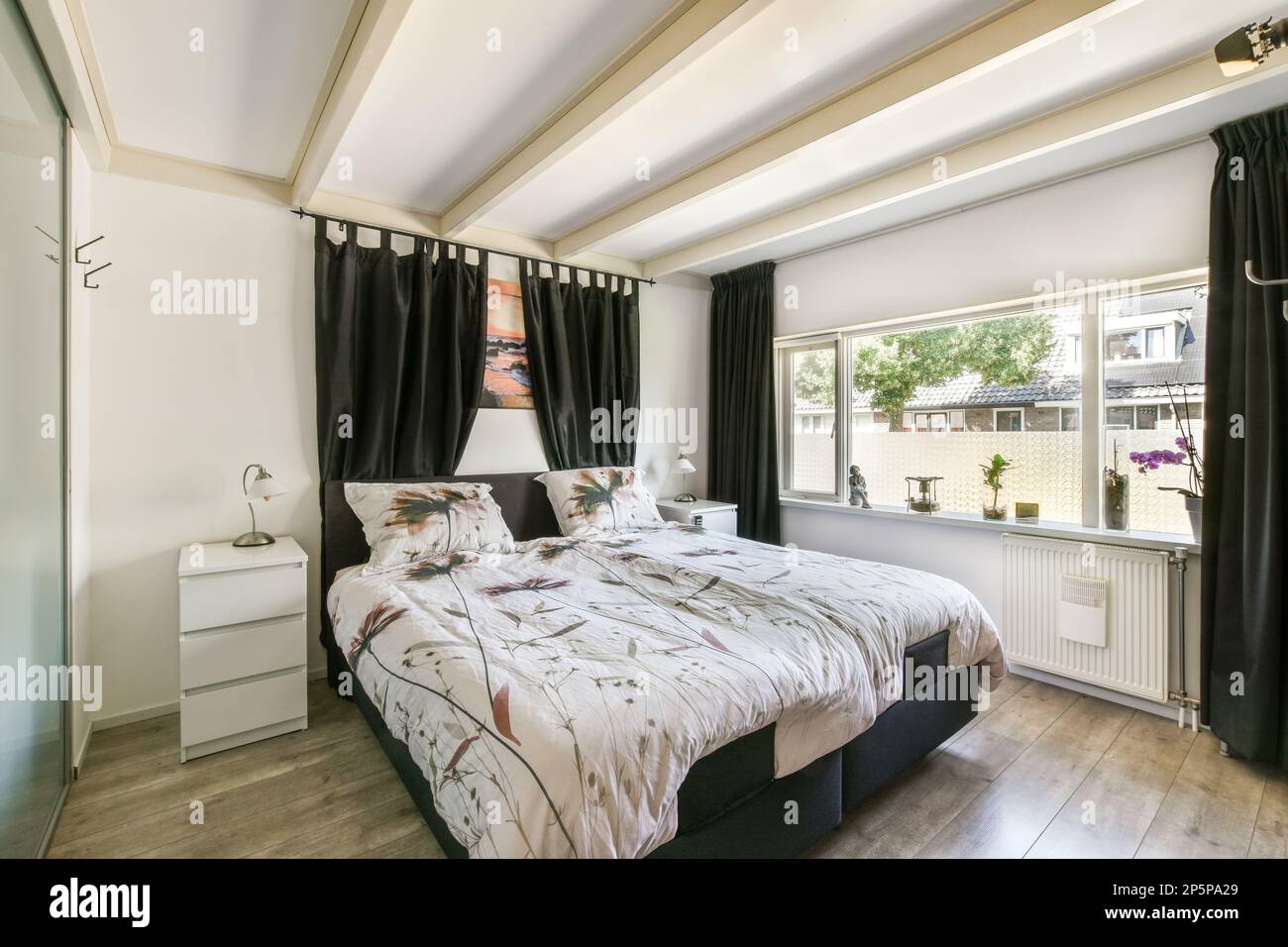 Amsterdam, Netherlands 10 April, 2021 a bed in a bedroom with black