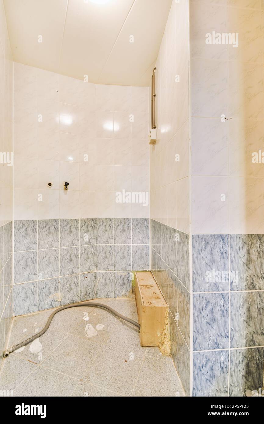 a bathroom that is in need of reurrectionment and repair work on the