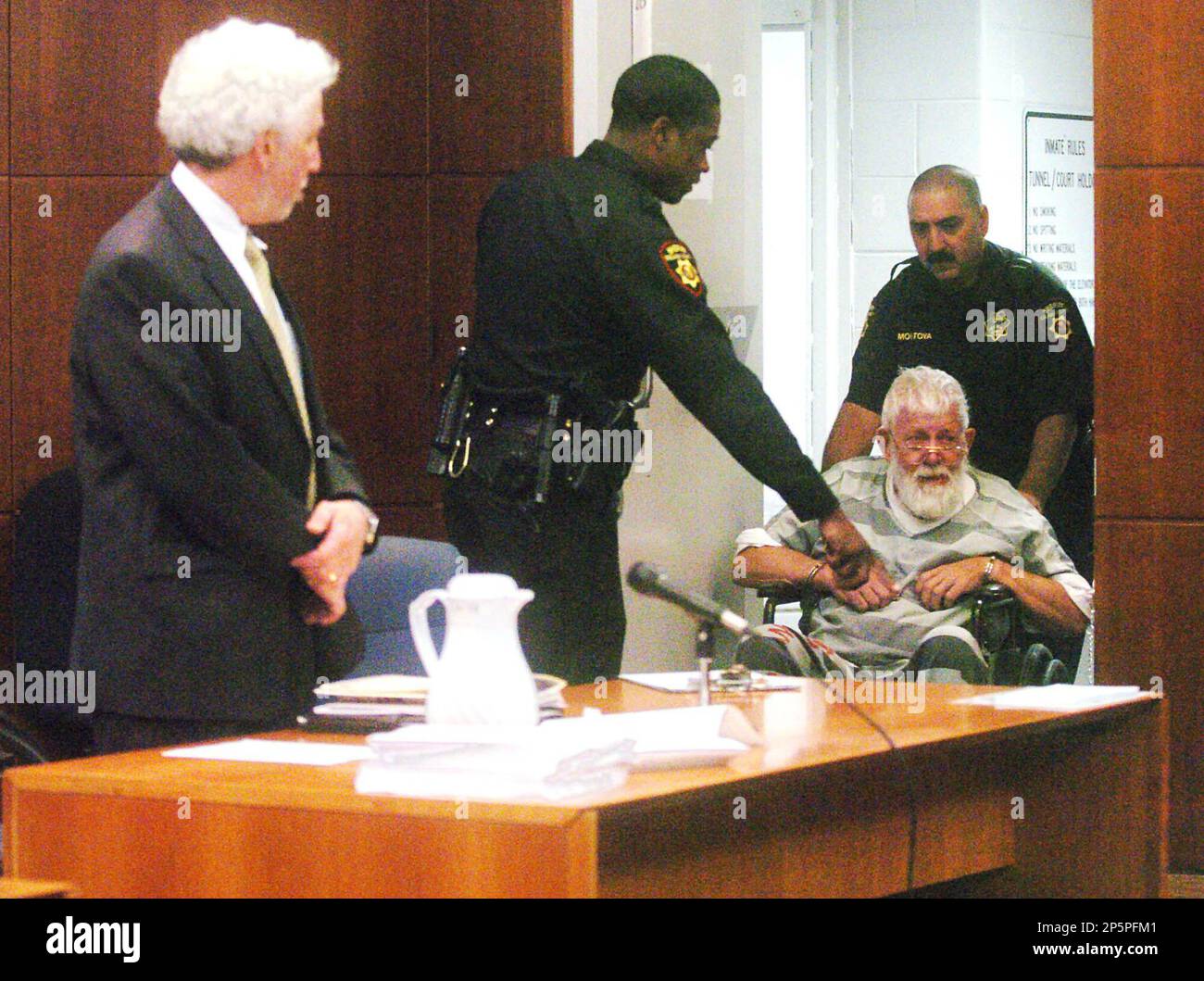 Dennis Stanworth, right, is assisted as he appears at the Solano County  Superior Court in Fairfield, Calif. on Friday, Jan. 11, 2013. Languishing  on death row for brutally raping a series of
