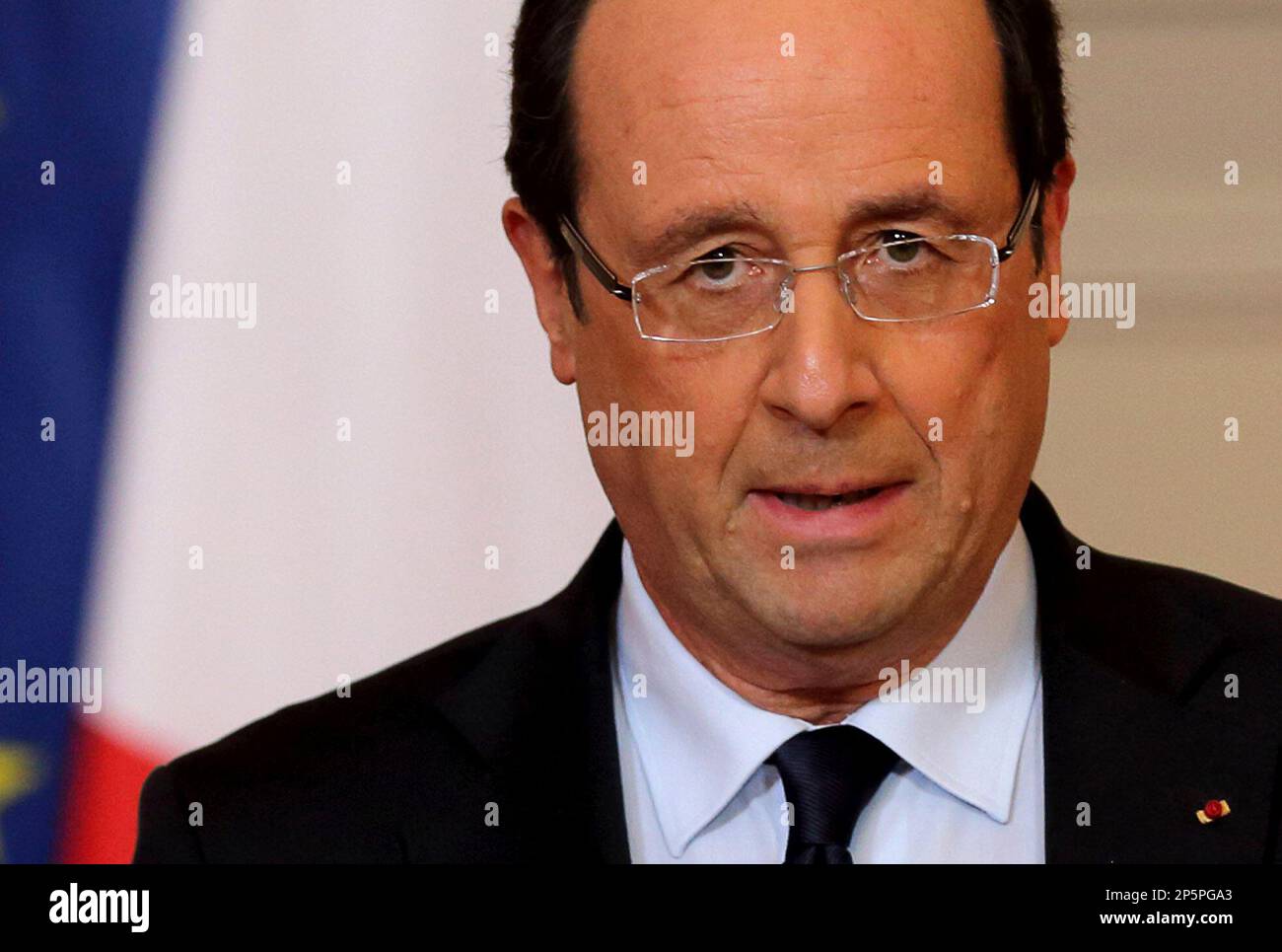 France's President Francois Hollande delivers a speech on the situation in Mali at the Elysee Palace in Paris, Friday, Jan. 11, 2013. French forces began backing Malian soldiers Friday in their fight against radical Islamists, drawing the former colonial power into a military operation to oust the al-Qaida-linked militants nine months after they seized control of northern Mali. French President Francois Hollande said that the operation would last "as long as necessary" and said it was aimed notably at protecting the 6,000 French citizens in Mali. Kidnappers currently hold seven French hostages Stock Photo
