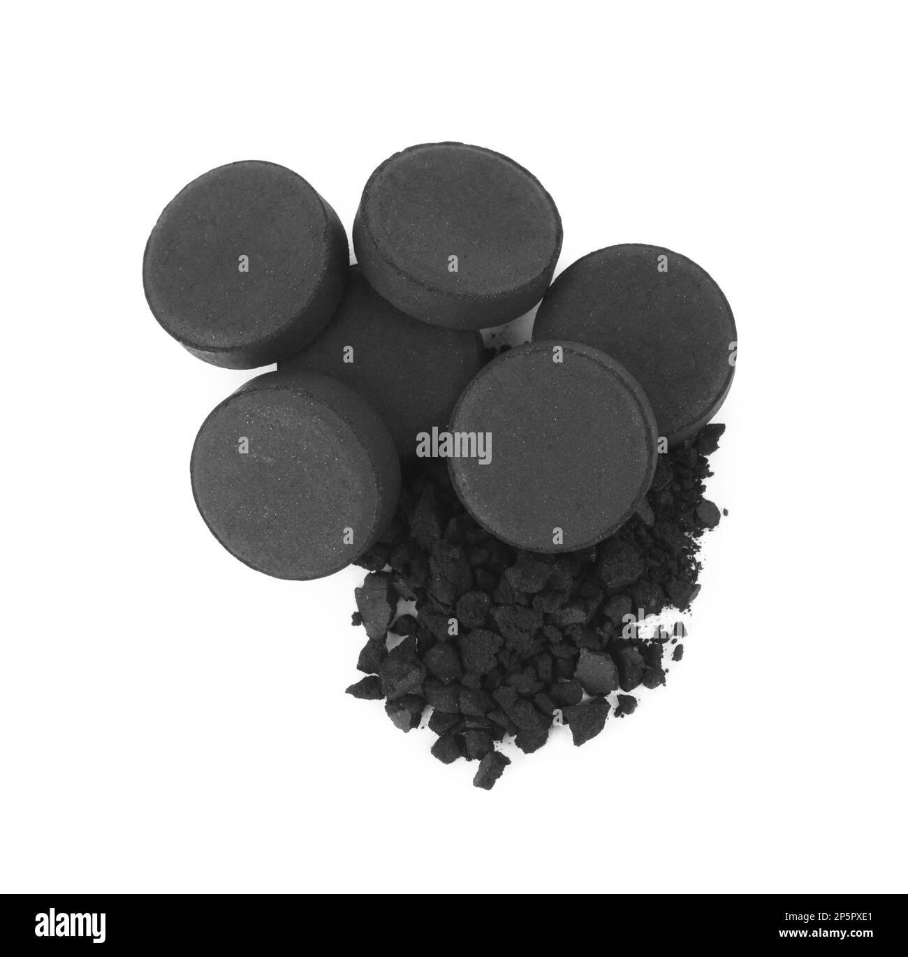 Activated charcoal on white background, top view. Potent sorbent Stock