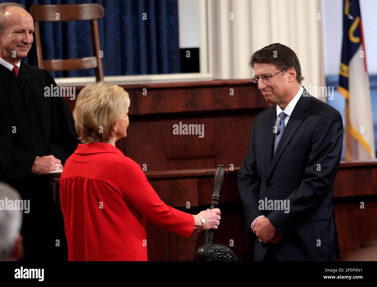 Gov.-elect Pat McCrory, right, and outgoing Gov. Bev Perdue participate ...