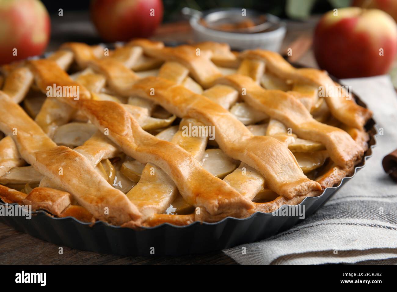 Delicious traditional apple pie on wooden table, closeup Stock Photo