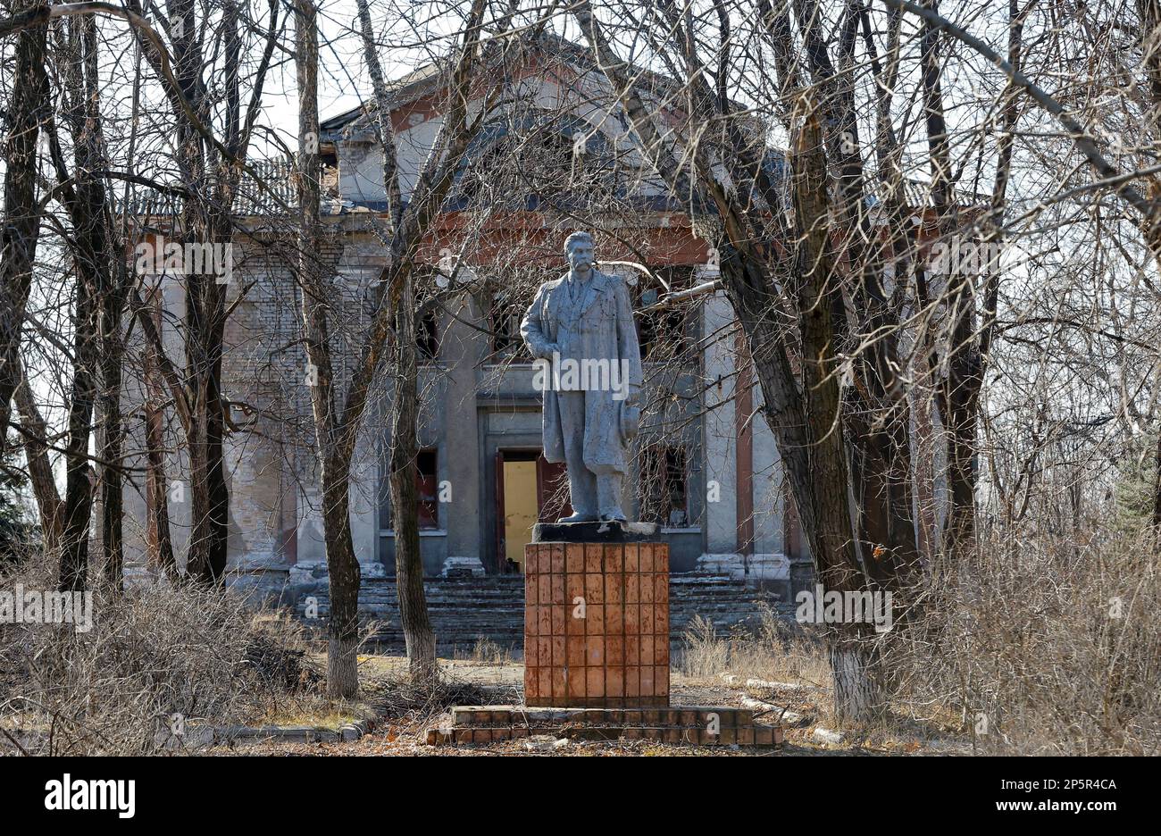 A view shows a monument to Russian writer Maxim Gorky in front of an abandoned community centre in the course of Russia-Ukraine conflict in the town of Zolote (Zolotoye) in the Luhansk region, Russian-controlled Ukraine, March 6, 2023. REUTERS/Alexander Ermochenko Stock Photo