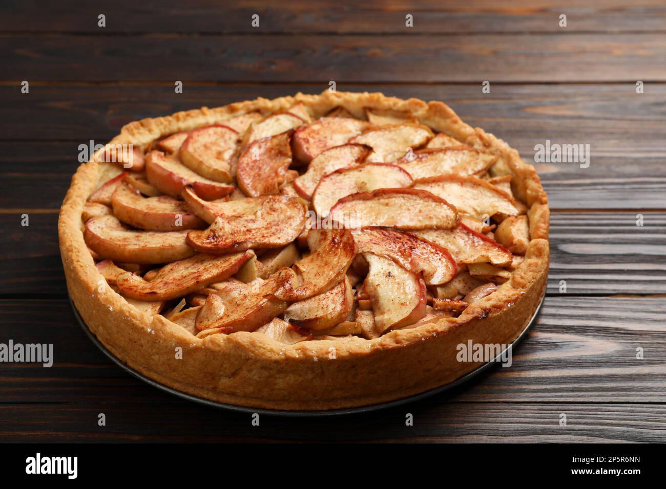 Fresh delicious apple pie on wooden table Stock Photo