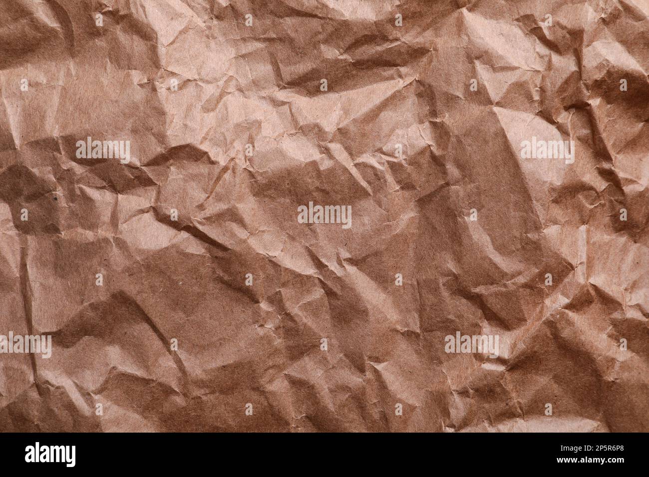 Close up crumpled craft paper texture and background with copy