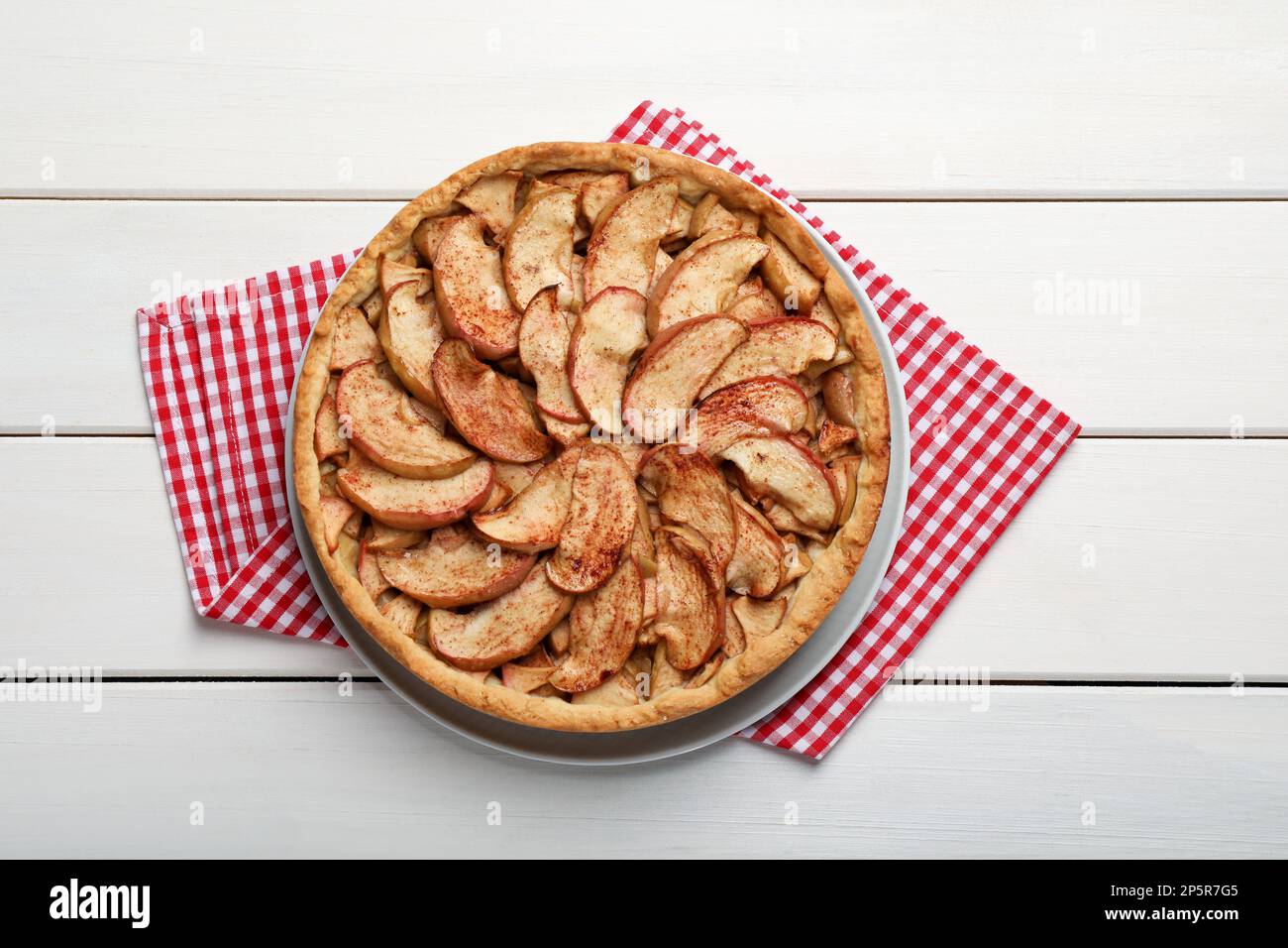 Delicious apple pie on white wooden table, top view Stock Photo