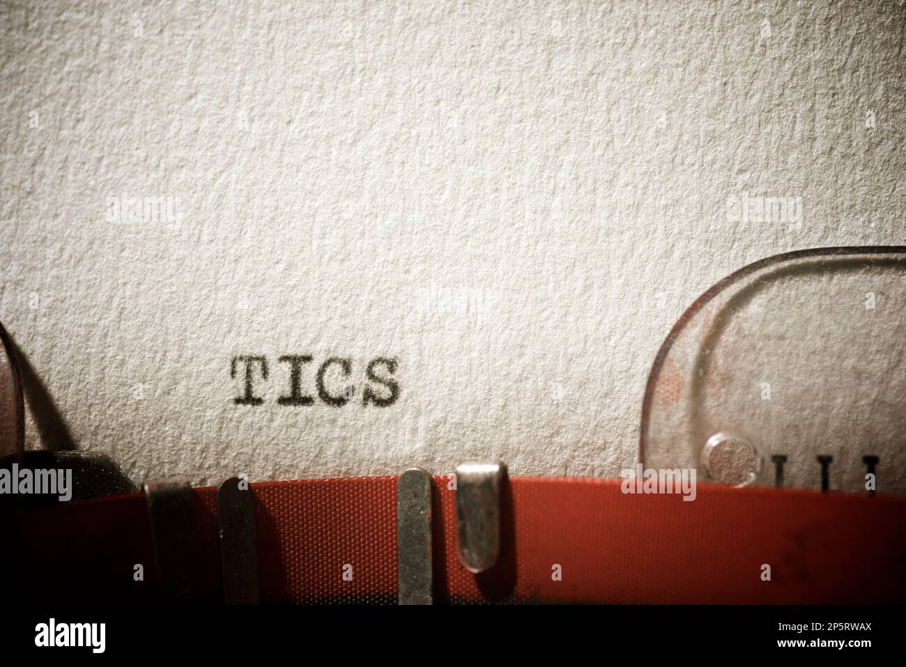 Tics word written with a typewriter. Stock Photo