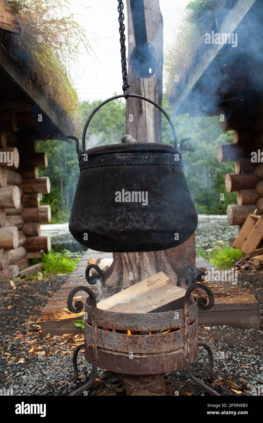 Cast iron boiler in the capm, cooking in nature Stock Photo Alamy