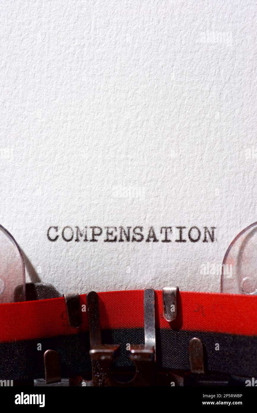 Compensation word written with a typewriter Stock Photo Alamy