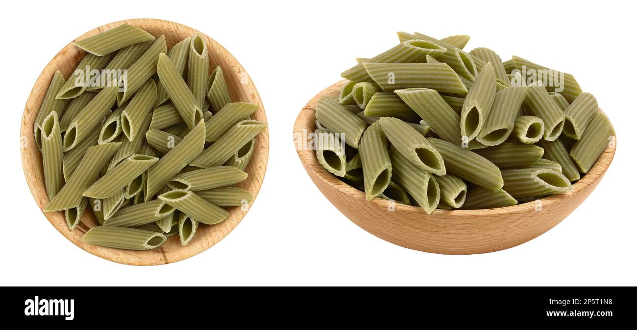 Green pea penne pasta in wooden bowl isolated on white background . Organic food speciality. Gluten free. Top view. Flat lay Stock Photo