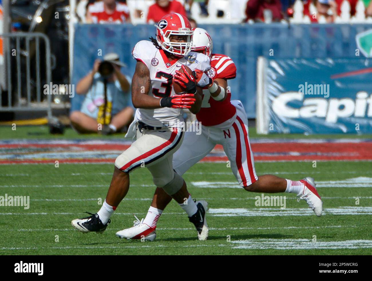 Georgia running back Todd Gurley (3) runs for yardage in front of ...