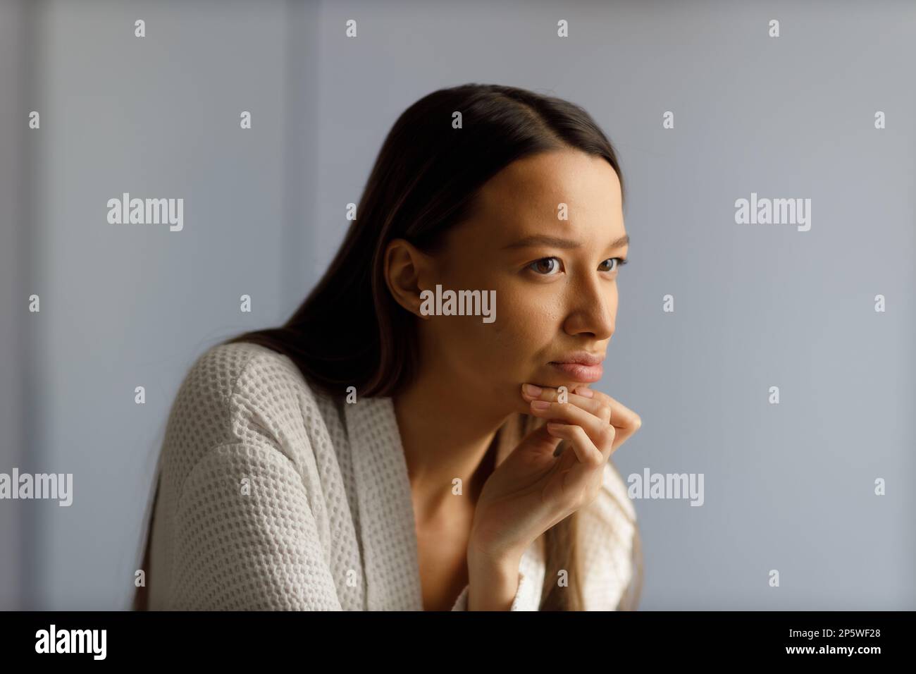 Attractive Upset Young Woman In White Bathrobe Examines Pimples On Her Face Problematic Skin On