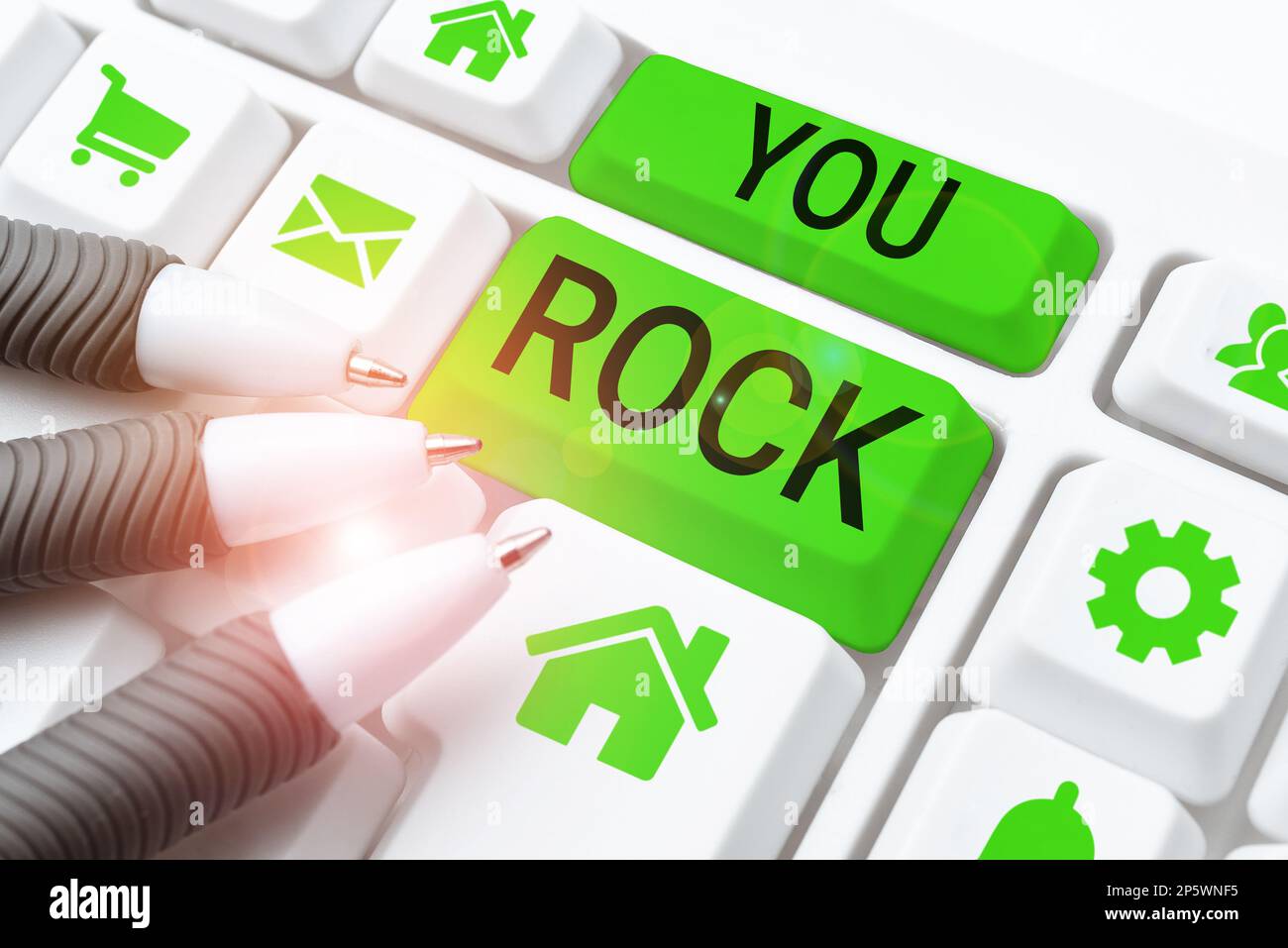 Hand writing sign You Rock. Concept meaning slang phrase of praise or