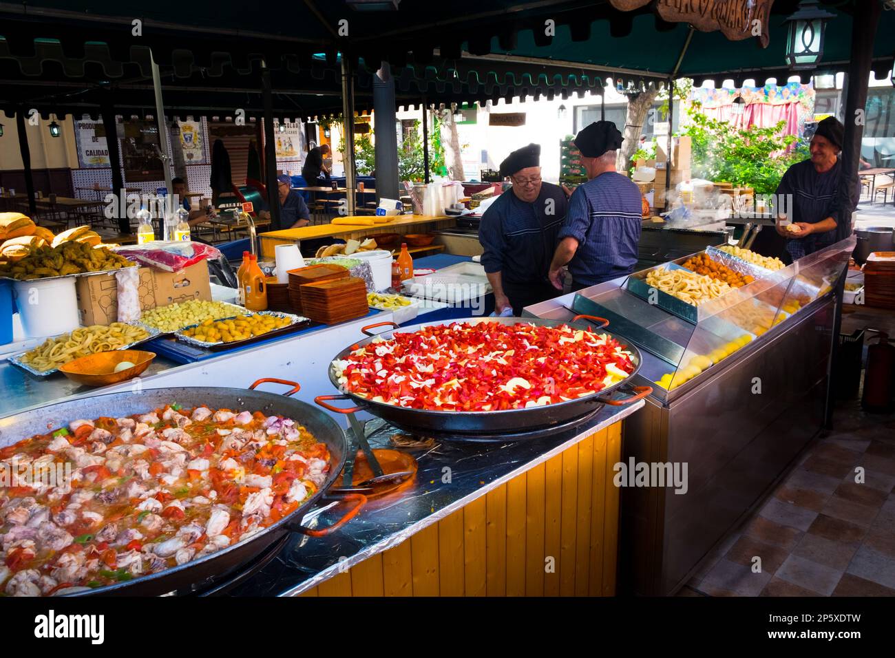 Making Paella at a fiesta in a market in Spain Stock Photo