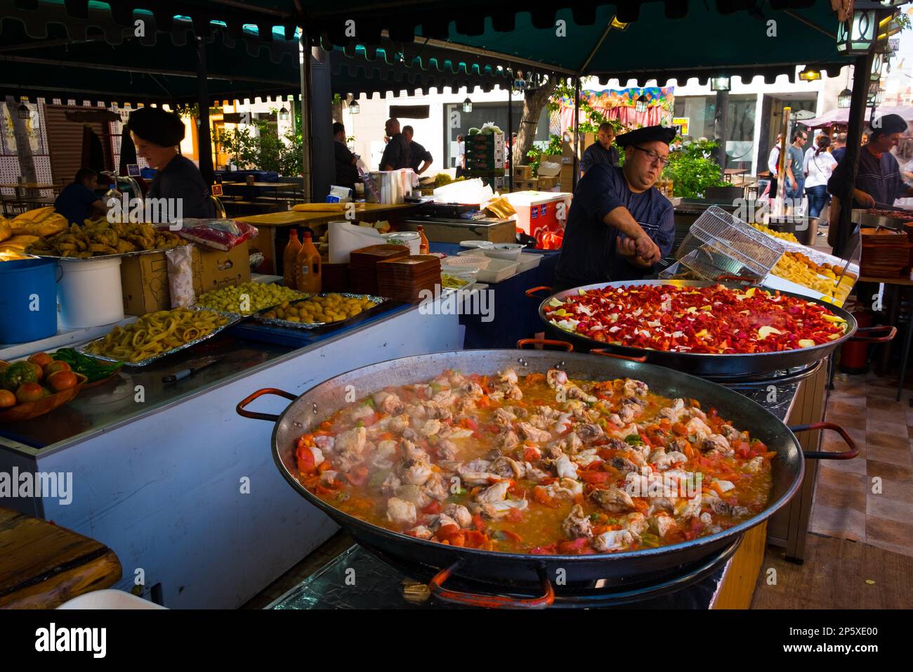 Making Paella at a fiesta in a market in Spain Stock Photo