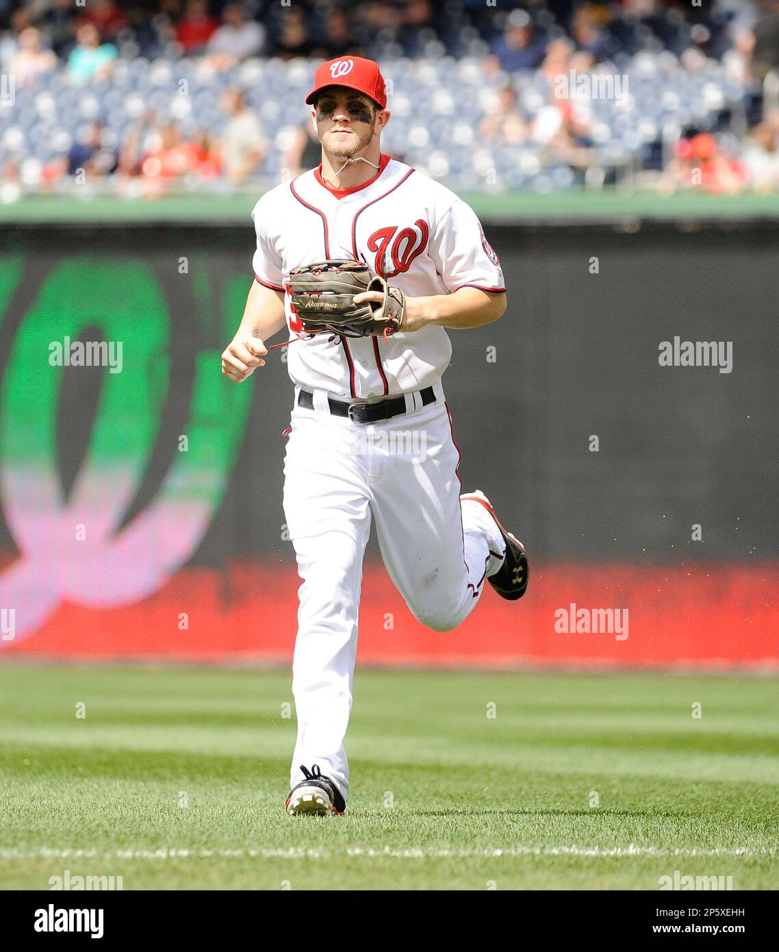 Washington Nationals Bryce Harper reacts in the dugout during game against  the New York Mets in the 3rd inning of game on Opening Day at Nationals  Park on April 6, 2015 in