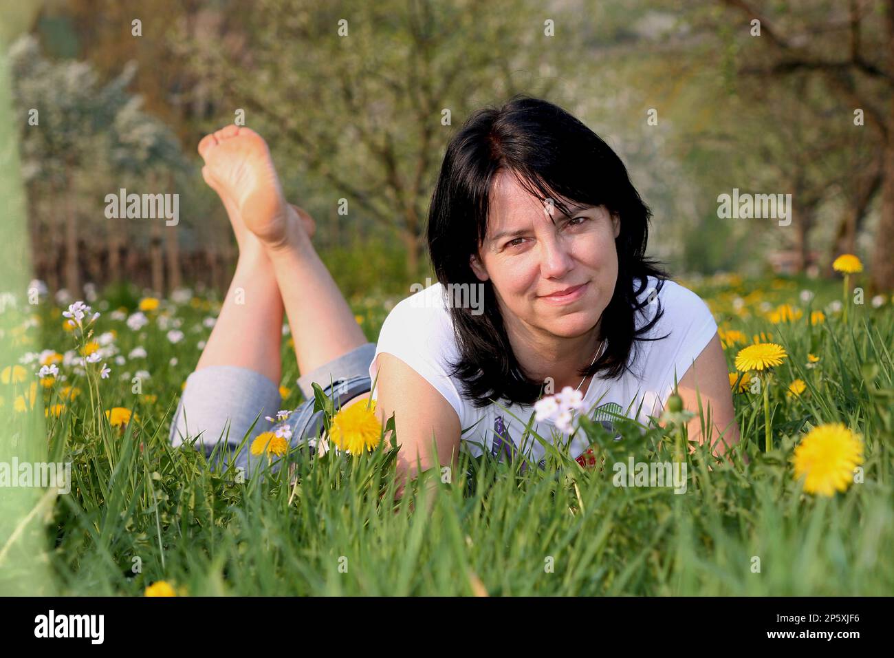 Middle aged adult woman lies hi-res stock photography and images - Alamy