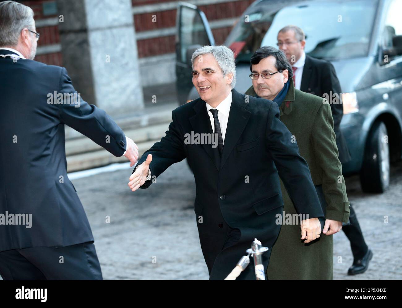 Austrian Prime Minister Werner Faymann is greeted by Oslo mayor Fabian Stang, left, outside the City Hall prior to the Nobel Peace Prize presentation ceremony Monday Dec. 10, 2012. (AP Photo / Stian Lysberg Solum, NTB scanpix) NORWAY OUT Stock Photo