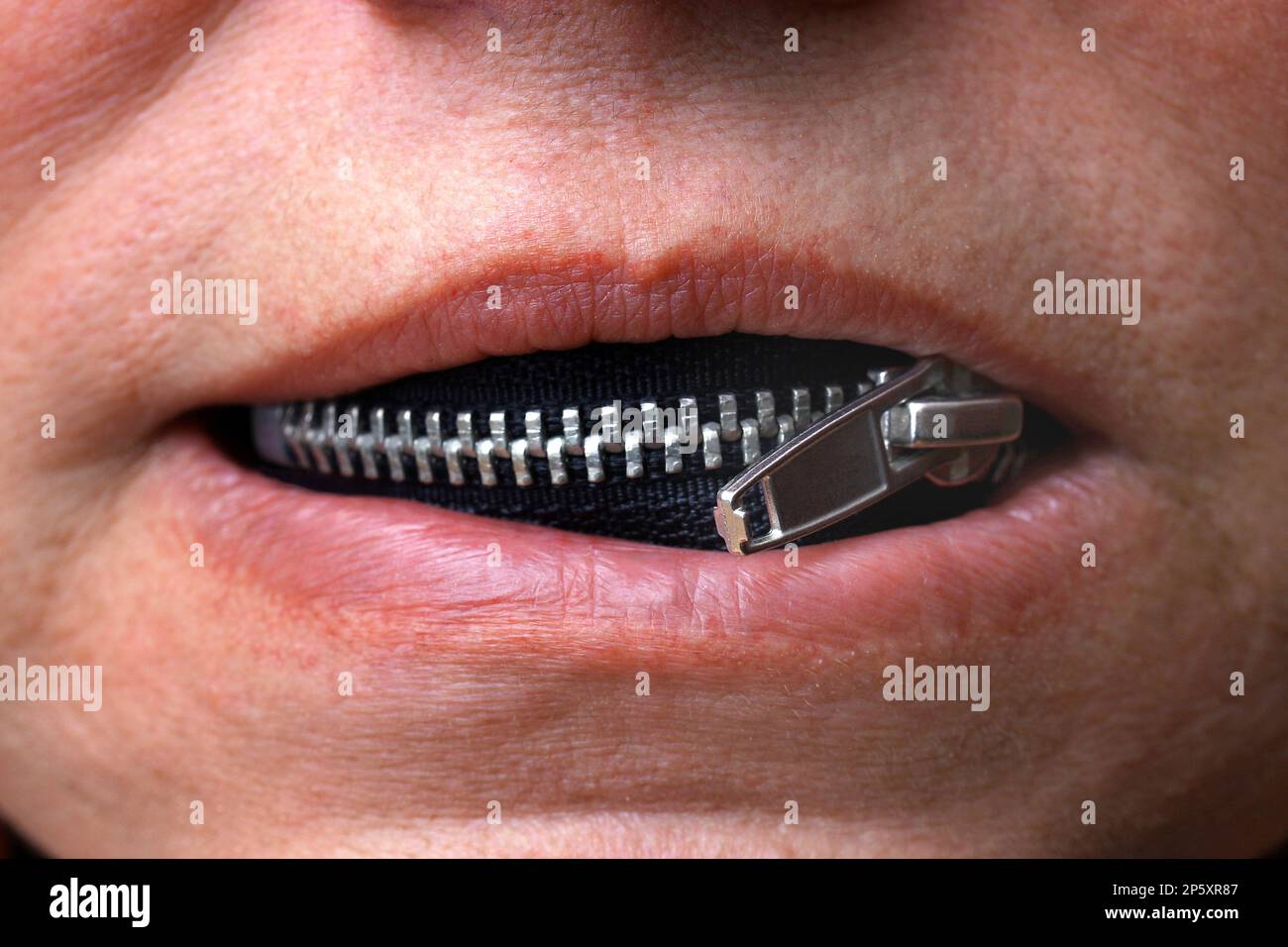 zipper in a mouth of a woman, silence Stock Photo Alamy