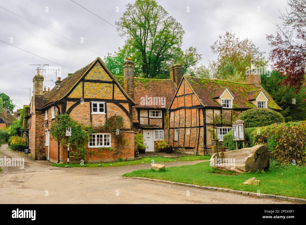 Historic old timbered period cottages near village green in Turville, Buckinghamshire, England, UK, Britain. A quaint village in the Chiltern Hills Stock Photo