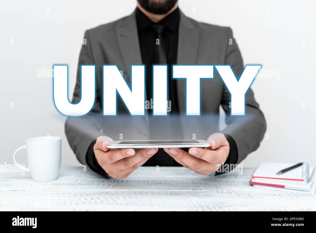 Text showing inspiration Unity. Business overview state of being united ...
