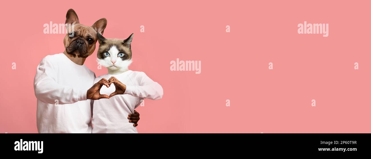 Loving african american couple with animal heads showing love gesture Stock Photo