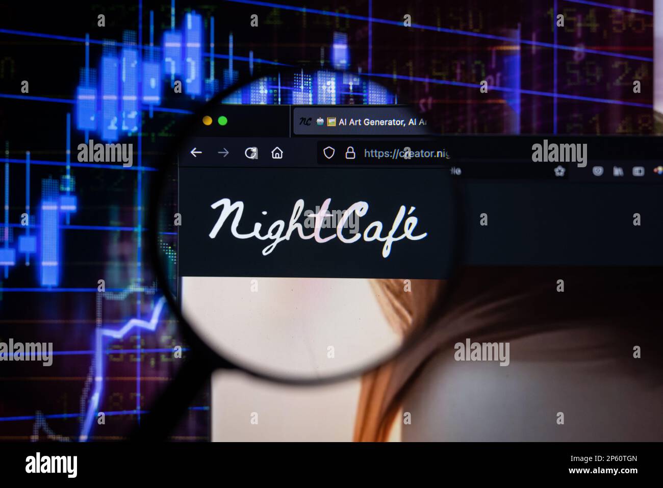 Nightcafe company logo on a website with blurry stock market developments in the background, seen on a computer screen through a magnifying glass Stock Photo