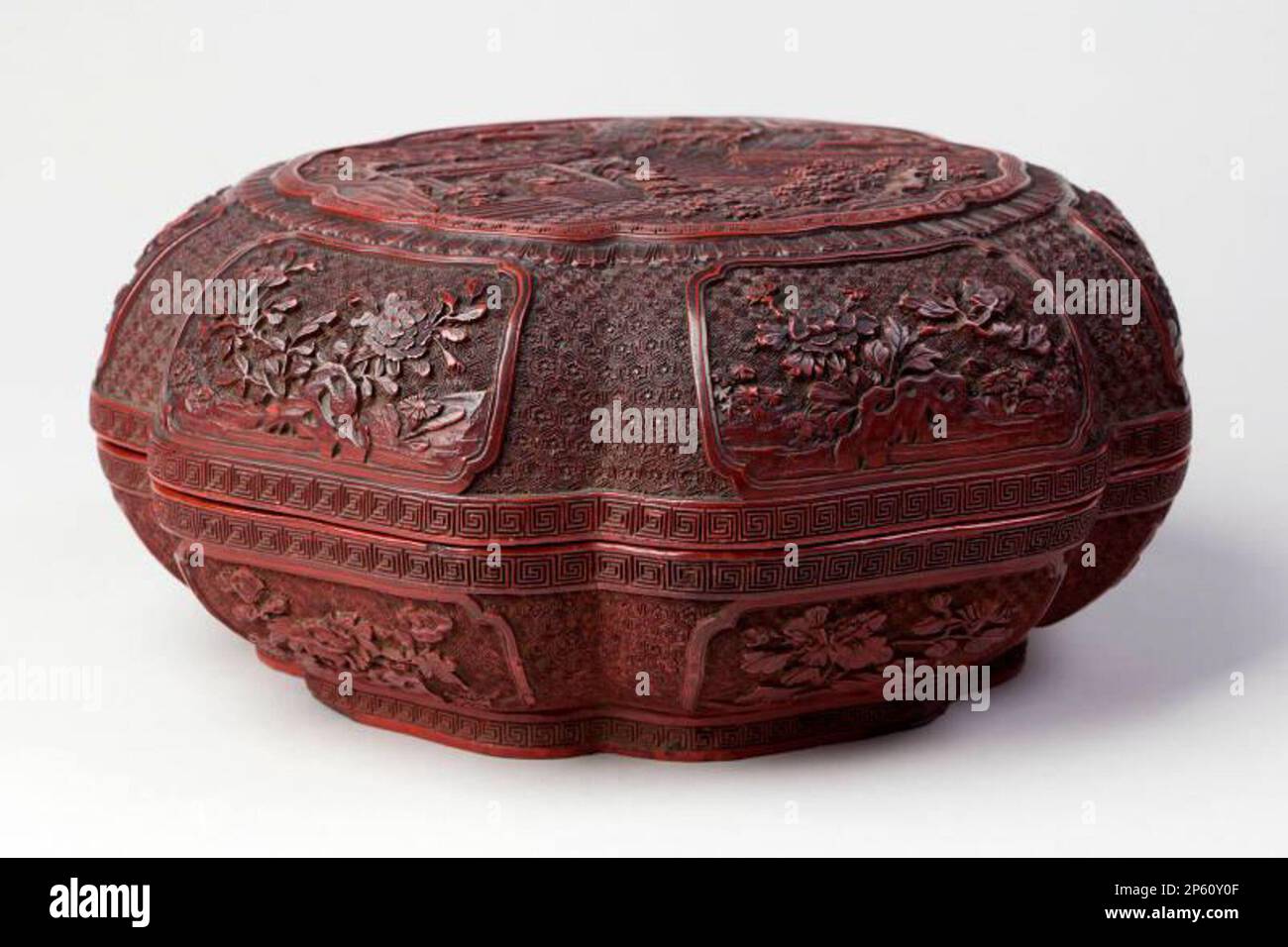 Chinese Red on Black Cinnebar Lacquer Lobed Box and Cover on Stand,  Qing Dynasty, Qianlong Period, 1736 - 1795 Stock Photo