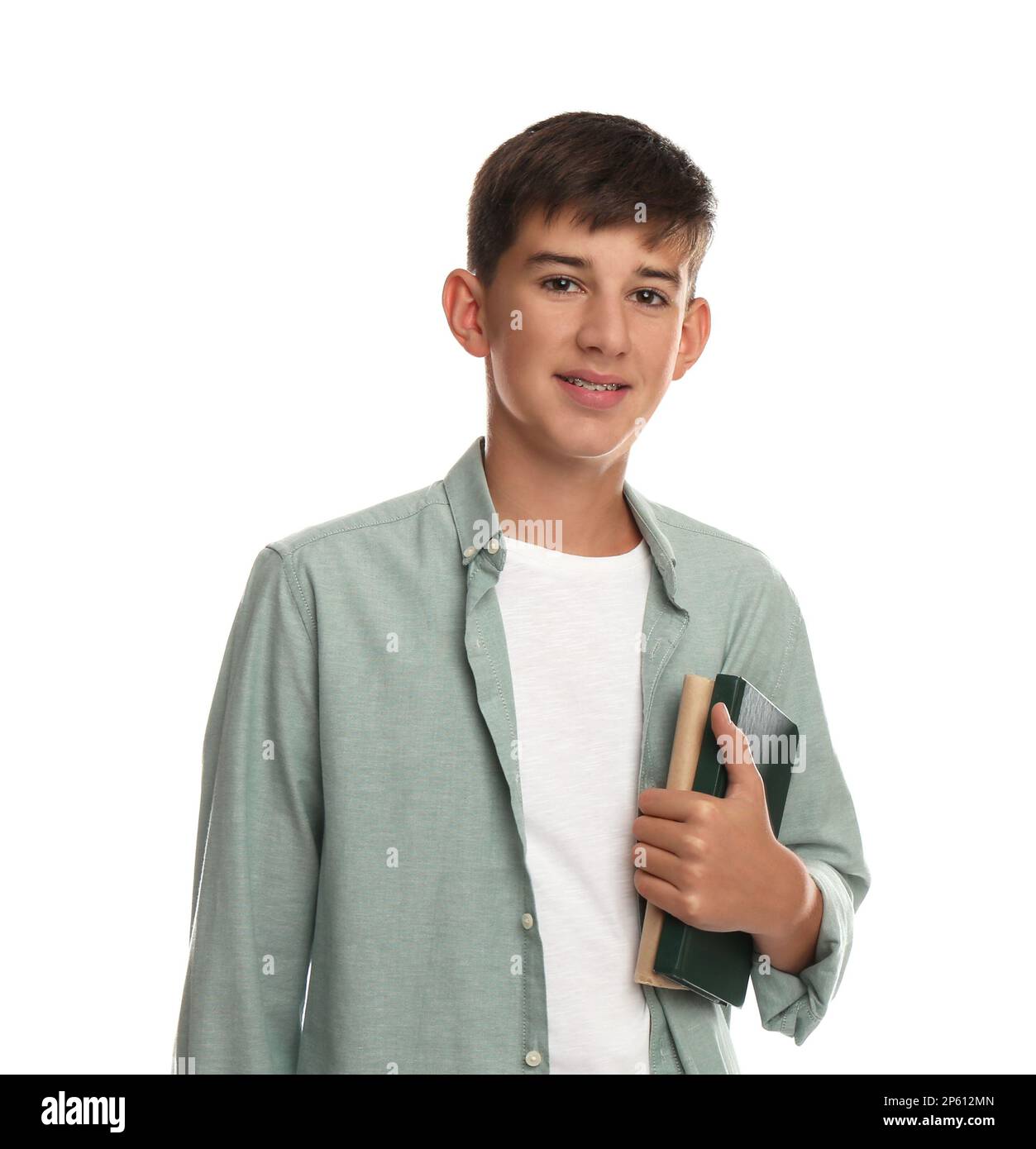 Teenage student holding books on white background Stock Photo - Alamy