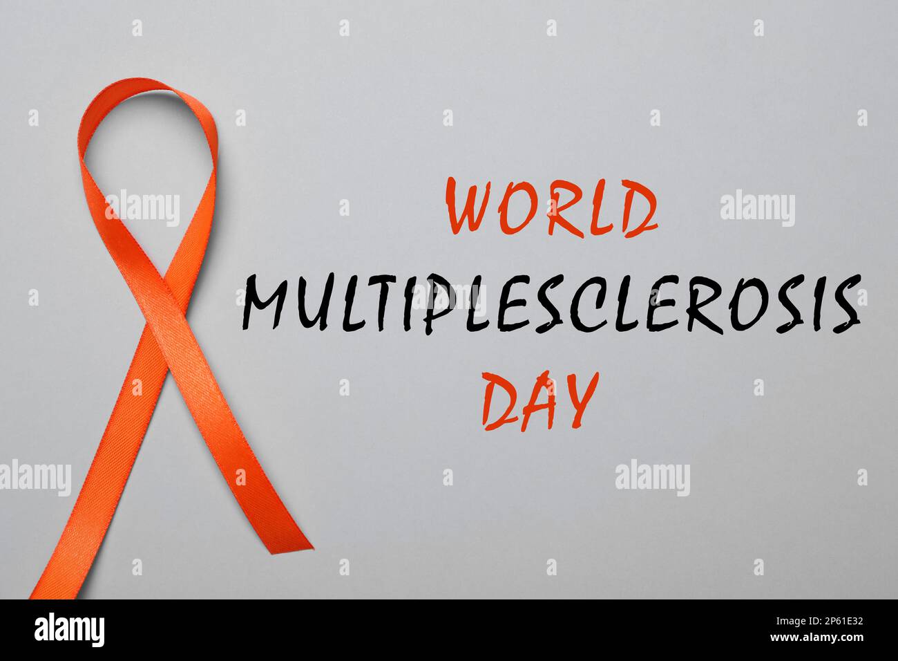 Multiple Sclerosis Awareness Day. Orange ribbon on grey background, top