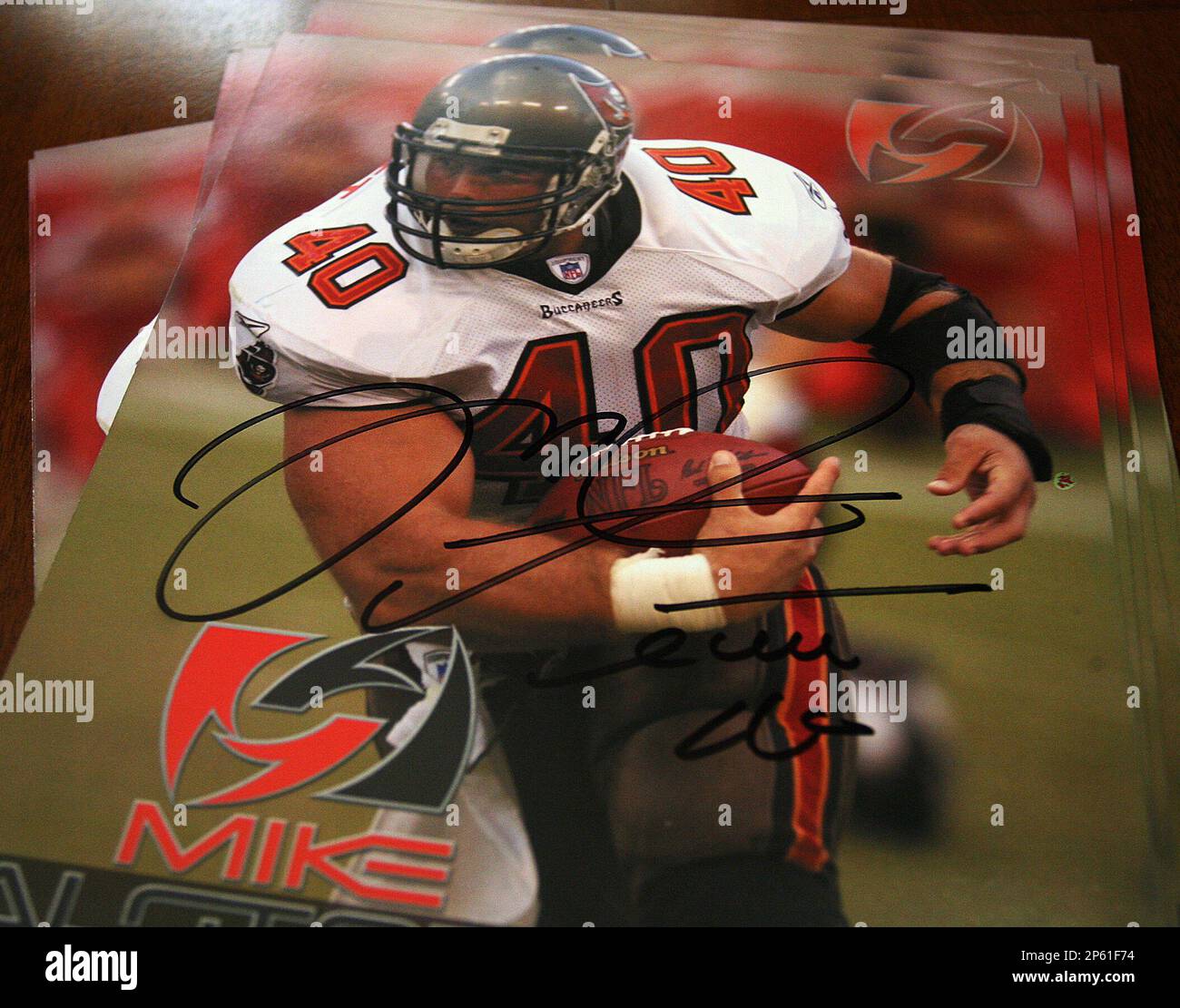 An autographed poster of former Tampa Bay Buccaneers fullback Mike Alstott  is for veterans and their family members, Friday Nov. 9, 2012 at the Fisher  House at Bay Pines Medical Center in